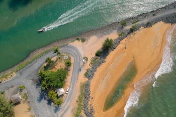 Aerial View of Ocean and Curved Road