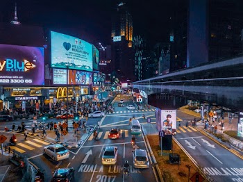Aerial View of People Walking on Street During Nighttime