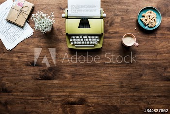 Aerial view of retro typewriter workspace concept and copy space