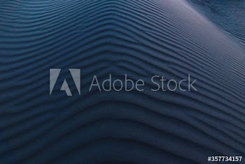 Aerial view of ripples on sand dune at dusk