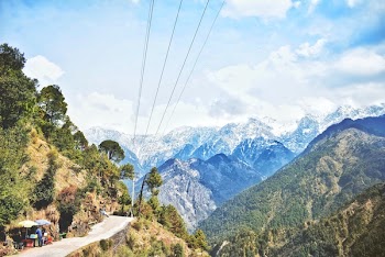 Aerial View of Road on Mountain With Utility Post