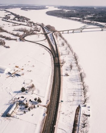 aerial view of road surrounded by white snows