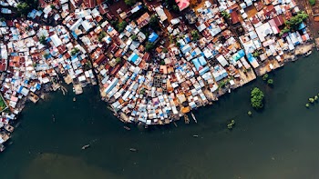 Aerial View Of  Roofs Of  Houses Along The River