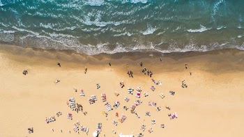 aerial view of seashore forming waves