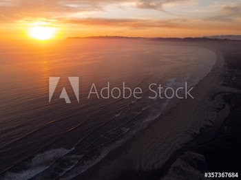 Aerial view of sunset over beach