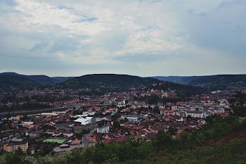 Aerial View of Town Under Cloudy Day Sky
