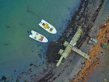 aerial view of two white boats on body of water