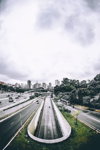 aerial view of underground road and city buildings at distance