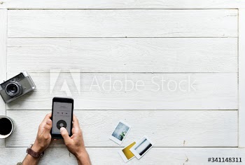 Aerial view of using smartphone music app and photography hobby concept with copy space