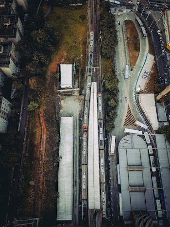 Aerial View of Vehicles on Road Near Buildings