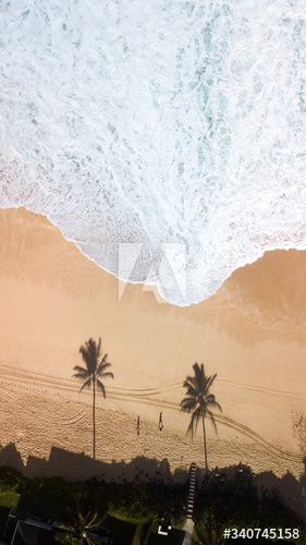 Aerial view of waves splashing on beach