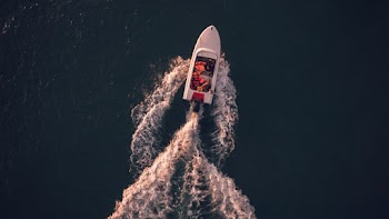 Aerial View of White Motorboat