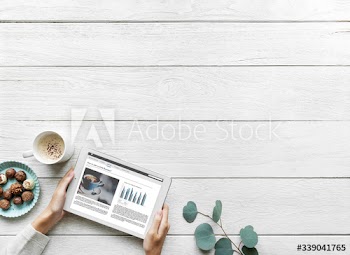Aerial view of woman using a digital tablet with design space startup concept
