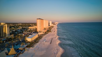 Aerial View Photo of Beach Beside Buildings