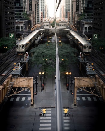 Aerial View Photo of Train Besides City Buildings