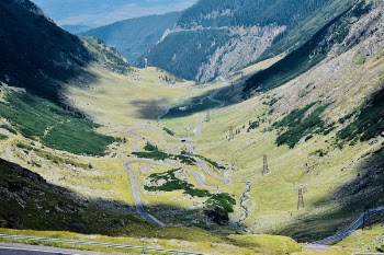 Aerial View Photography of Asphalt Road in Between Mountain
