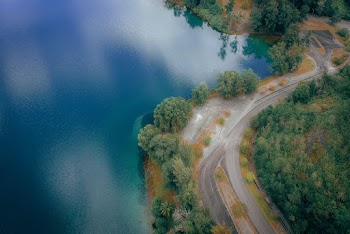 Aerial View Photography of Roadway Near Lake