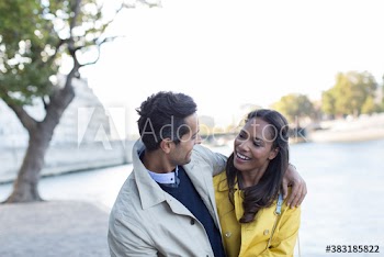 Affectionate couple hugging at Seine River, Paris, France