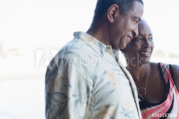 Affectionate senior couple looking away