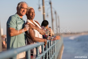 Affectionate senior couple on pier