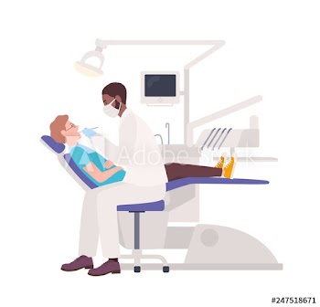 African American dentist examining male patient lying in chair