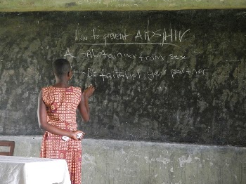 African teacher educating about AIDS. | Free Photo - rawpixel