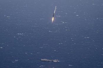 aircraft carrier and missile launching during daytime