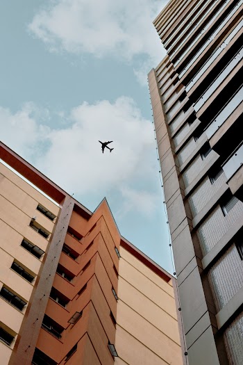 Airplane Above A Building