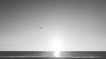 Airplane Flying Above Ocean