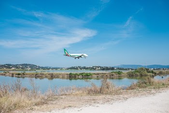 Airplane Flying over Body of Water