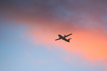 Airplane on Sky during Golden Hour