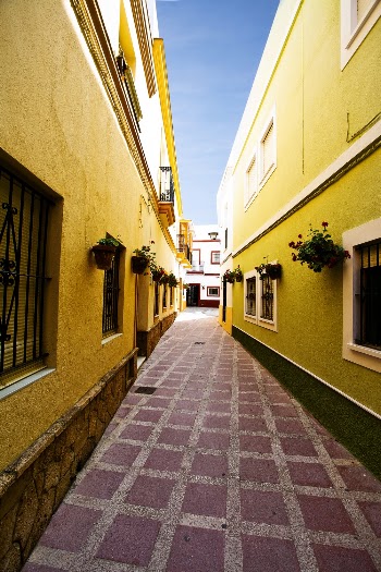 Alley Between Yellow Buildings