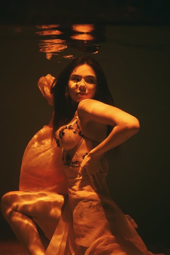 Alluring Woman submerged underwater
