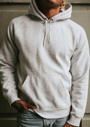 Alternative man in a white hoodie