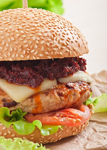 American burger with chicken and bacon, homemade barbecue sauce Free Photo