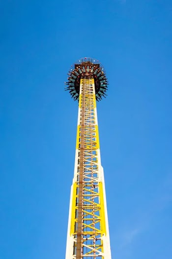 Amusement park, carousel at sunny day