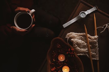 Analog Watch On Top Of Brown Wooden Surface