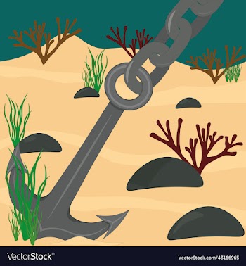 anchor with chain on sandy sea bottom