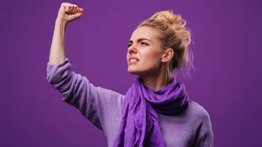 Angry Blonde Woman Protesting in Purple Sweater on Vibrant Background Angry Blonde Woman Protesting in Purple Sweater on Vibrant Background