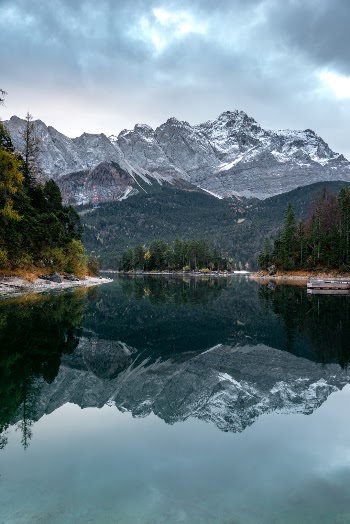 Another photo from my trip last autumn to the Eibsee. This time it is from really early in the morning when the sun was still behind the mountains, but there was absolutely no wind so I got a perfect reflection of the Zugspitze in the Eibsee. (My polarizer might have helped a tiny bit to improve it even more :))