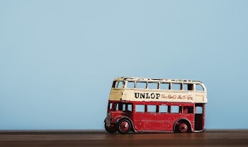 Antique Toy Bus With Flat Tire