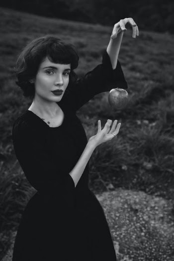 Apple Floating in Front of a Woman · Free Stock Photo