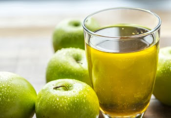 Apple Juice in Drinking Glass Beside Green Apples