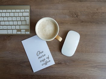 Apple Magic Mouse and White Ceramic Mug