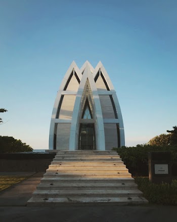 Arc Building Standing Under Clear Sky