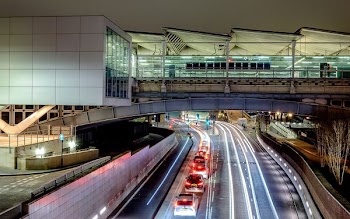 architectural photograph of white and brown bridge over road