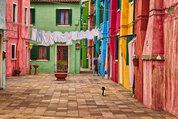 Architectural Photography of Green, Yellow, Red, and Pink Houses