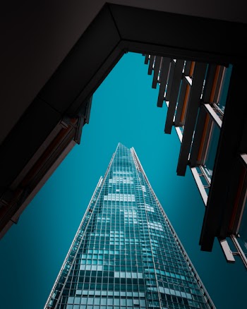 Architectural Photography of Teal High-rise Building
