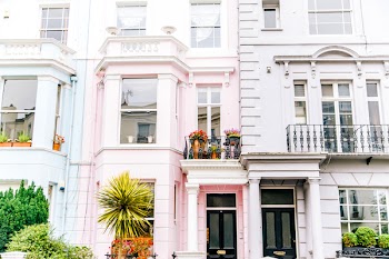 Architectural Photography of White and Pink High-rise Building