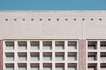 architectural photography white and beige concrete building